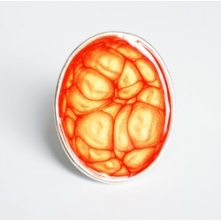 Bague ajustable ovale orange avec des reflets jaunes