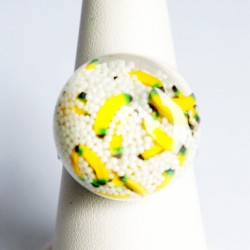 Ring with white microbeads...