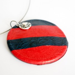 Round red and navy blue pendant.