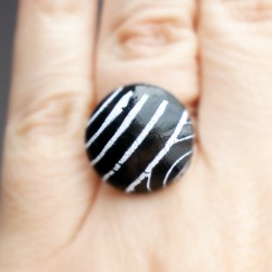 Small black ring with white stripes