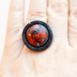 Small red and black adjustable ring