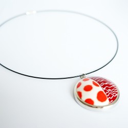 Round pendant with polka dots and scribbles