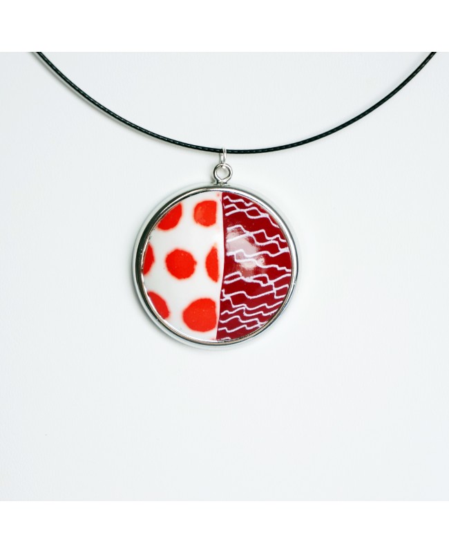 Round pendant with polka dots and scribbles