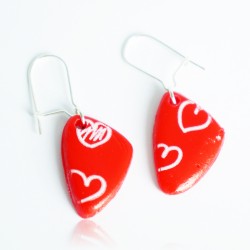 Red earrings with white hearts
