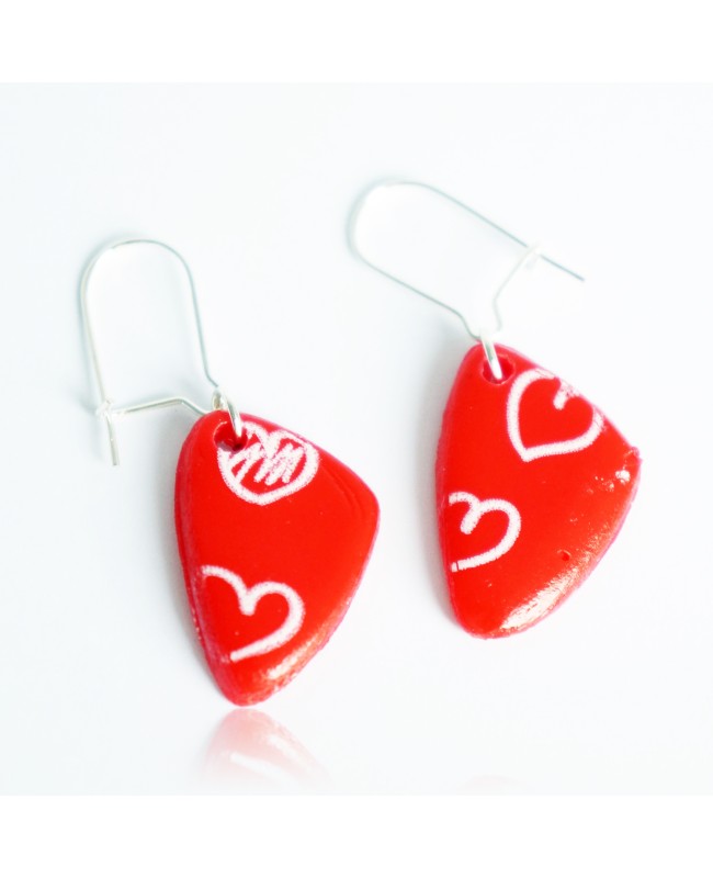 Red earrings with white hearts