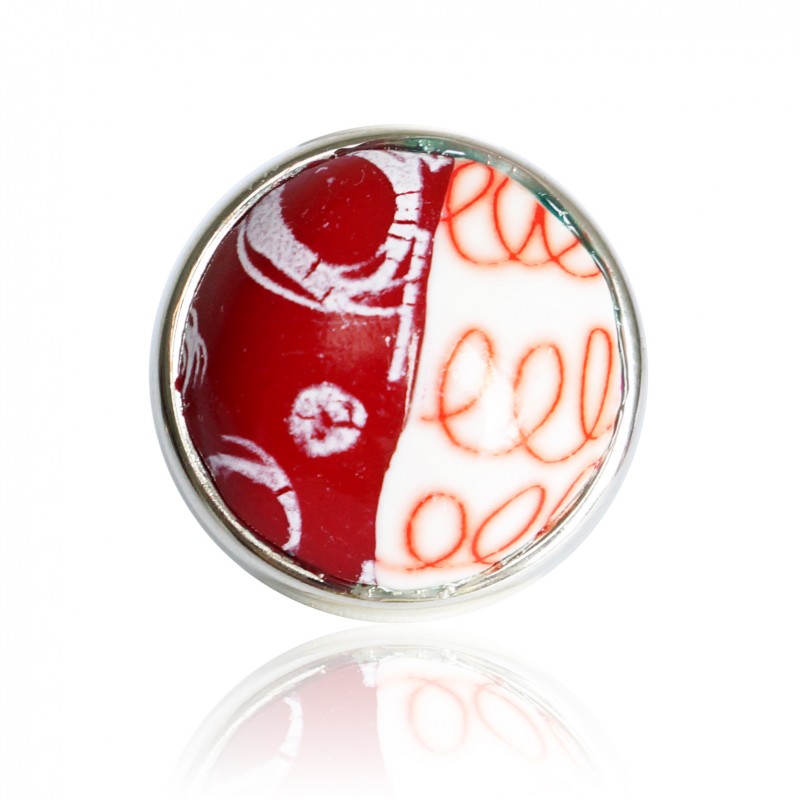 Red and white ring with circles and spirals