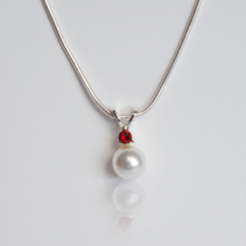 White, pearly bead and red diamente pendant