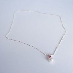 White, pearly bead and red diamente pendant