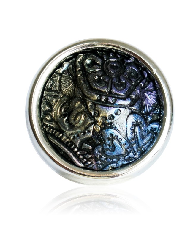 Large black ring with metallic reliefs