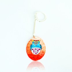 Blue Owl Keychain on Orange Background