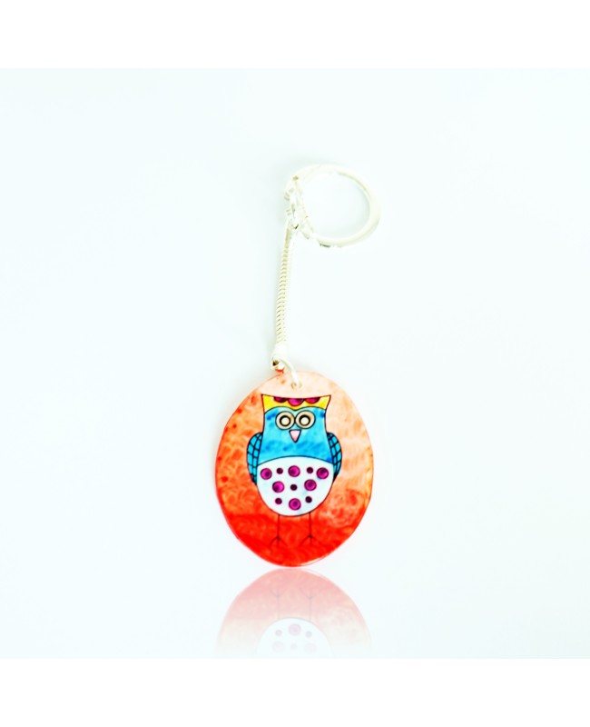 Porte-clé hibou bleu sur fond orange