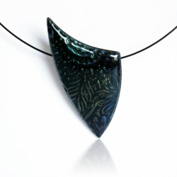 Black pendant with metallic reflections.