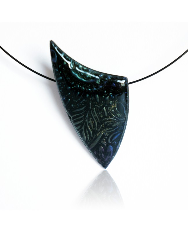 Black pendant with metallic reflections.