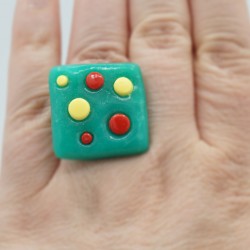 Square green ring with yellow and red polka dots