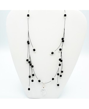 Black and white bead necklace with a crystal leaf pendant Mid-length necklaces
