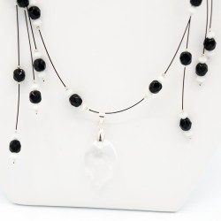 Black and white bead necklace with a crystal leaf pendant