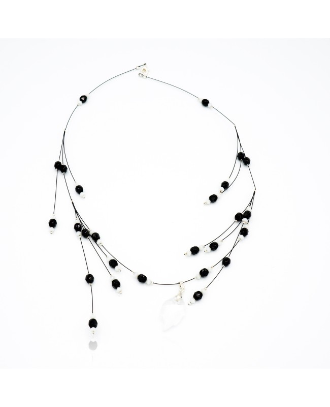 Black and white bead necklace with a crystal leaf pendant