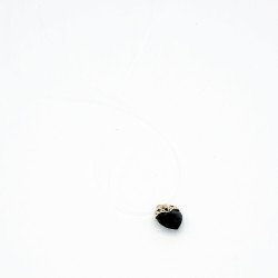 A small black heart pendant with a nylon cord