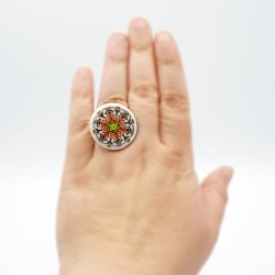 Mandala ring in brown, orange, red, and yellow