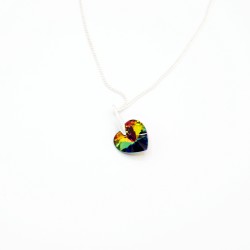 Green heart pendant with multicolored reflections