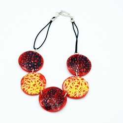 Red necklace with yellow and black scribbles