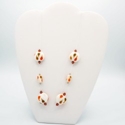 Fancy necklace in white, orange, and brown.