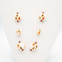 Fancy necklace in white, orange, and brown.