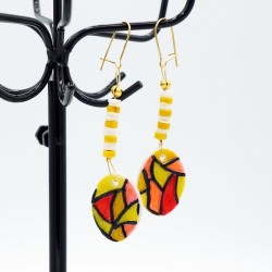 Earrings stained glass yellow, white, and red.
