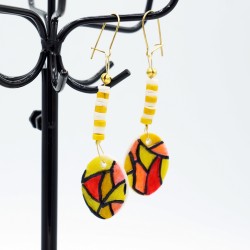 Earrings stained glass yellow, white, and red.
