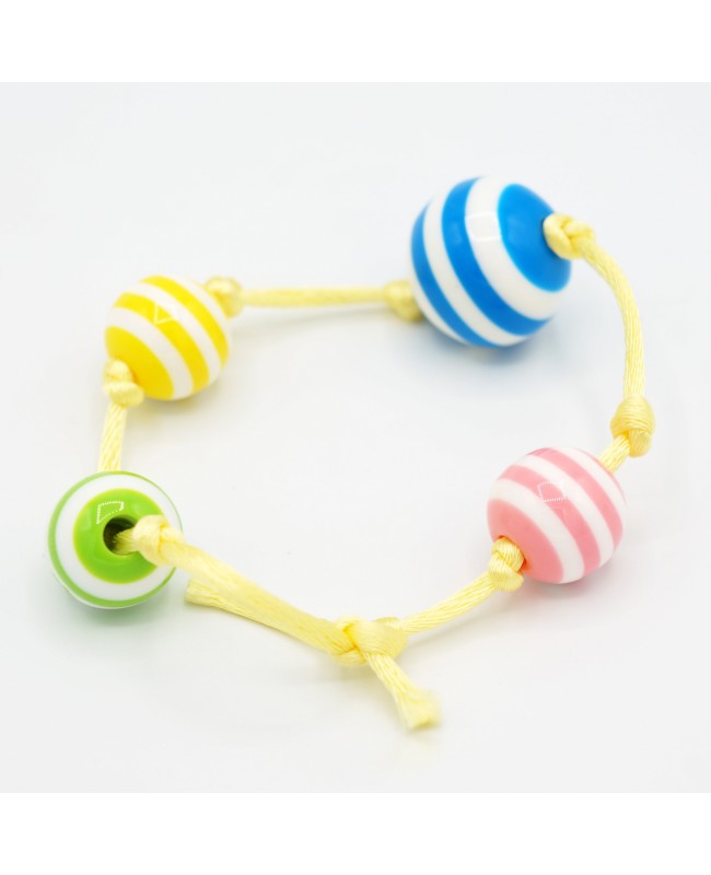 Petit bracelet jaune avec des perles à rayures Bracelets