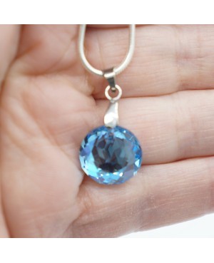 Silver choker necklace with a clear crystal pendant