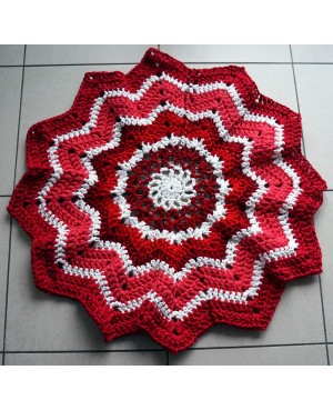 Star- or rosette-shaped rug made with crochet.